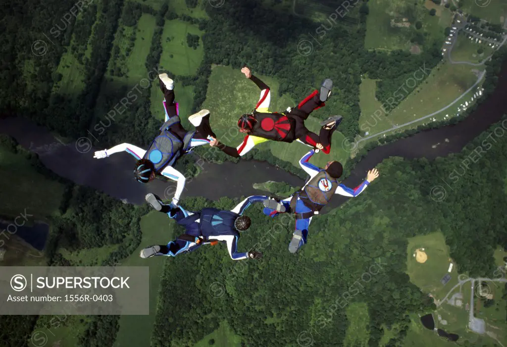 Four people skydiving