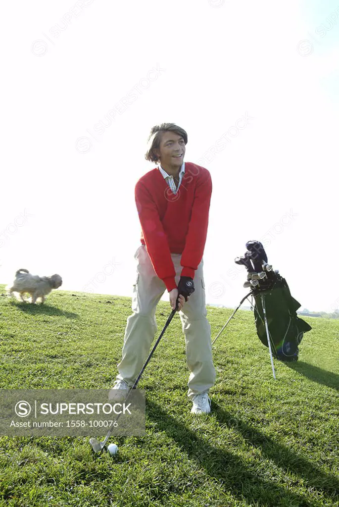 Golf course, man, young, stand, Golfbag,  Background, dog, fuzziness,  Back light,  18-20 years, 20-30 years, golfers, whole bodies, leisure time, Lif...
