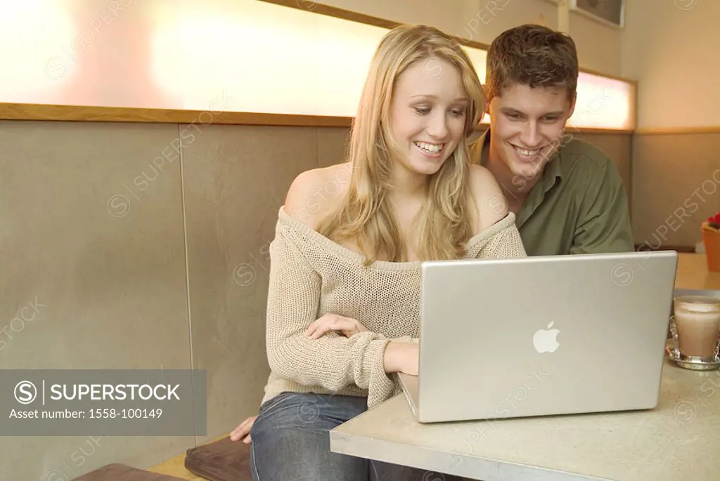 couple, young, smiling, laptop, cafe, sitting,  Half portrait,  no property release!,  Series, 20-30 years, leisure time, Lifestyle, pub, reading indo...
