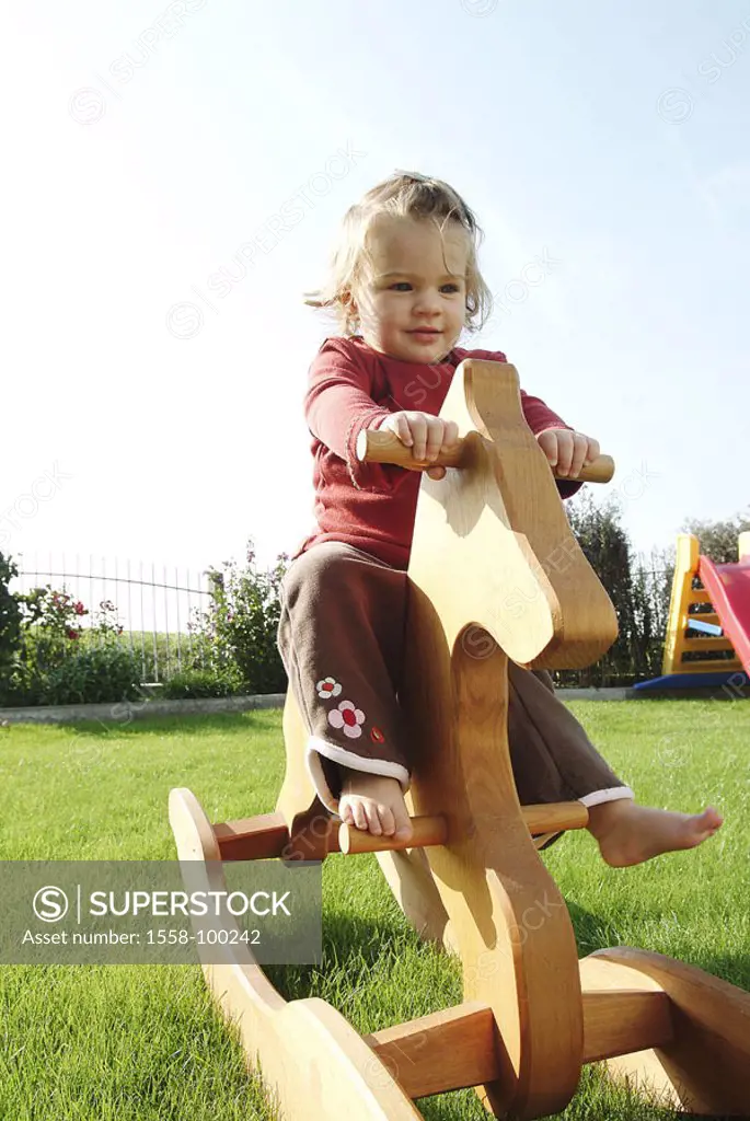 Meadow, girls, nakedfoot, rocking horse,  sitting,   Child, toddler, 2-4 years, happily, happy, sunny, outside, leisure time, childhood, whole bodies,...
