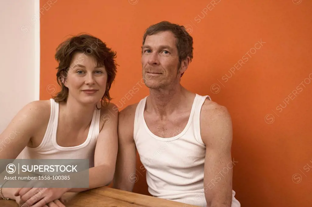 Table, couple, middle age, undershirts, sitting, relaxing, half portrait, in the morning,   30-40 years, 40-50 years, happily, underwear, unshaven, un...