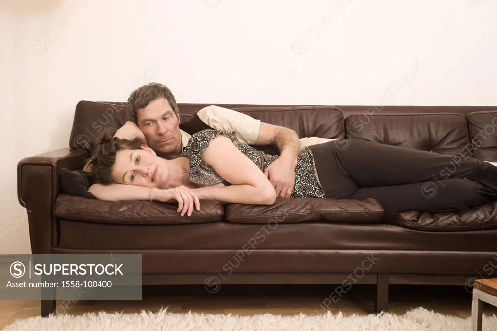 Couch, couple, middle age, lie, together, man, woman, embraces,  Living rooms, 30-40 years, 40-50 years, careful, approach, guard dreamed away, partne...