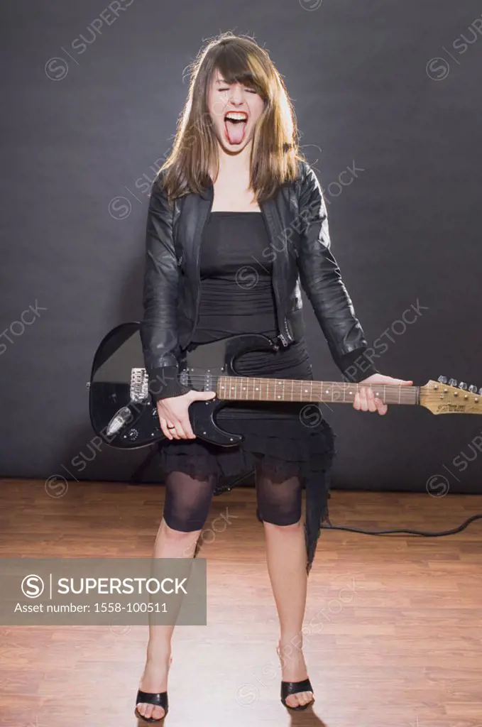 Woman, young, E-Gitarre, omitted,    Series, 20-30 years, brunette, long-haired, clothing black, leather jacket, skirt, guitar, music instrument, make...