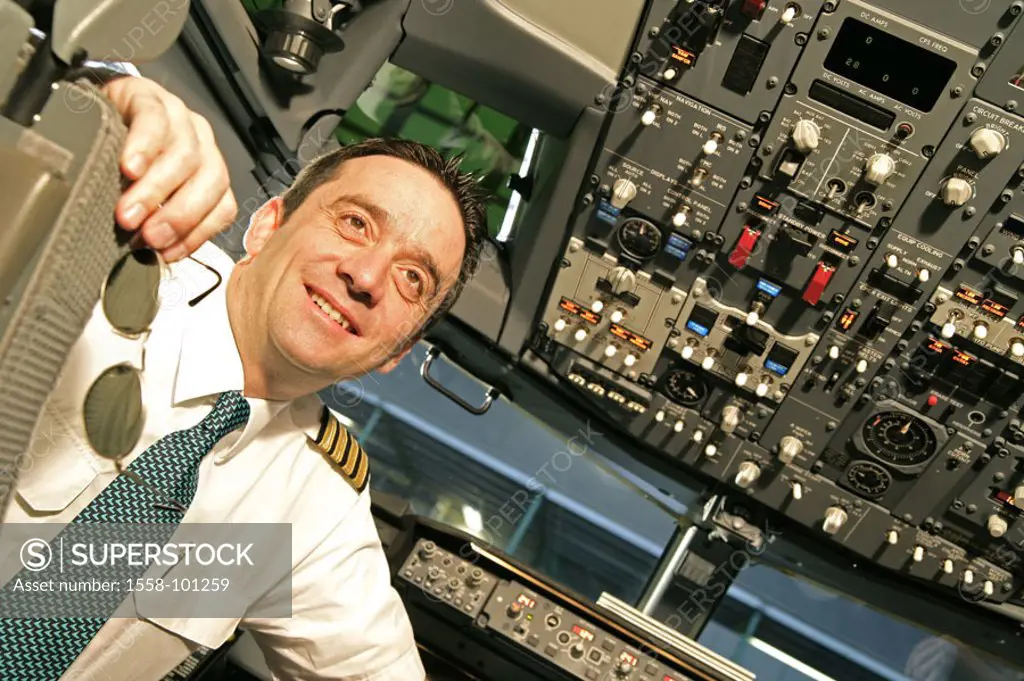 Passenger airplane, cockpit, pilot, smiling, Halbporträt,   Series, pilots, man, sitting, turning, kindly, confidently, airplane, Boeing 737-700, arma...