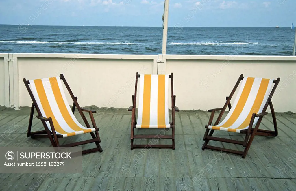 Netherlands, Noordwijk, coast,  Terrace, deck chairs, empty,   North sea, outlook terrace, sandy beach, sun decumbences, sun chairs, yellow-white, aba...