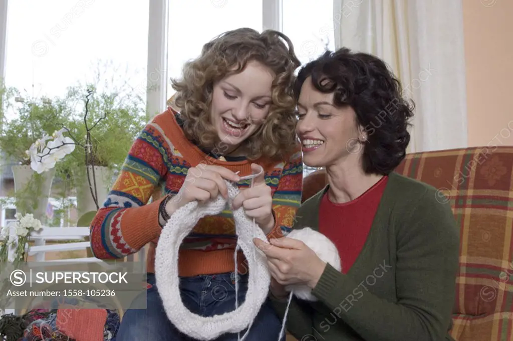 Mother, daughter, knitting, smiling, chairs,  sitting,   Series, people, women, two, happy, blond, brunette, curls, teenagers, 15-20 years, parent, 30...