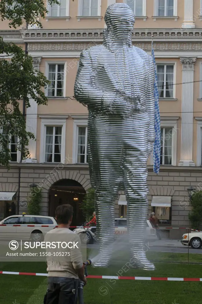 Germany, Upper Bavaria, Munich, Promenade place, Aluminium-Skulptur, ´Count Montgelas´, workers, hose, view from behind, detail,  Bavaria, Bavarian ya...