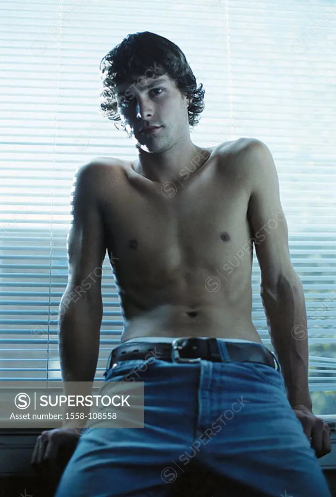Man, young, upper bodies freely, jeans, cool, detail, indoors, people, 20-30 years, 30-40 years, brown-hairy, curls, gaze camera nonchalant, casual se...