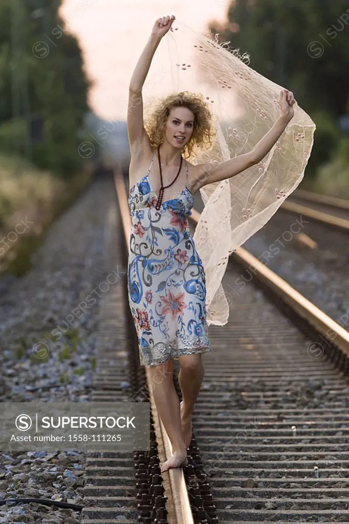Woman, young, summer-dress, barefoot, railroad-rails, balances, cheerfully, series, people, 20-30 years, curls, dress, necklace, silk-cloth, holds up,...