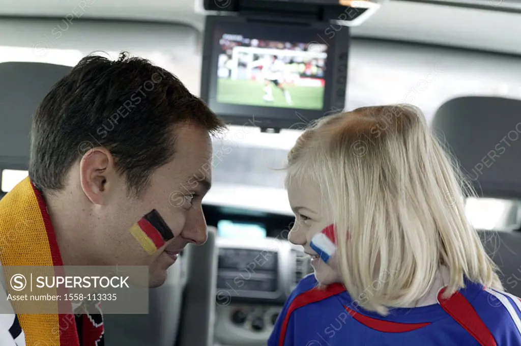 Watches television car, indoors, father, daughter, laughs, soccer game, in Car-Entertainment, monitor, technology conversation fun Autofahren vehicle,...