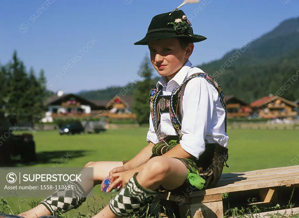 Germany, Bavaria, meadow, boy, official dress, wood-palette, summers, sits no release, waiter-Bavaria, models Trachtler, leather shorts, suspenders, h...