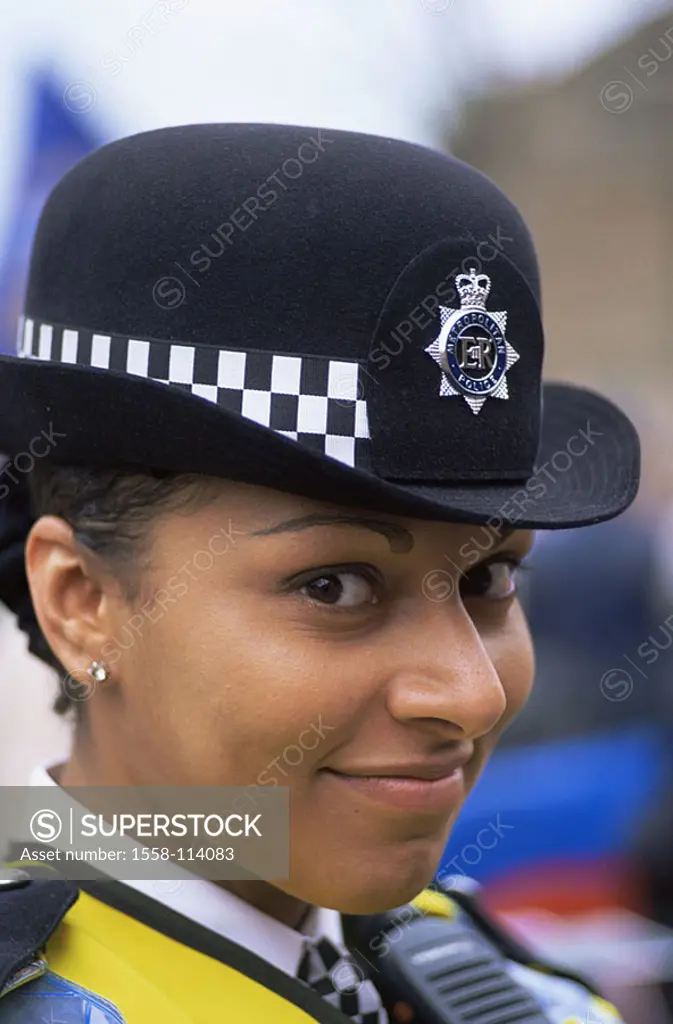 Great Britain, London, police officer, smiles, portrait, no models capital, people, woman, Asian, release, England, swarthily, uniform, hat, headgear,...
