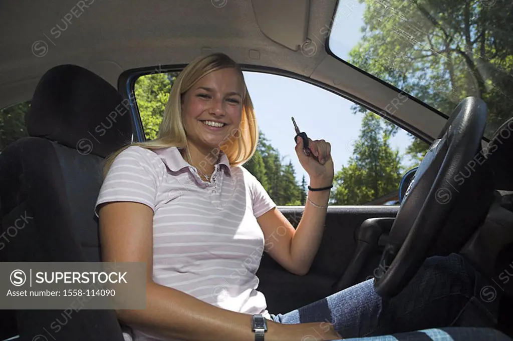 Woman, young, happily, ignition keys, holds, car, sits, at the side, series, people, teenagers, teenagers, 18 years, blond, long-haired, driving-begin...