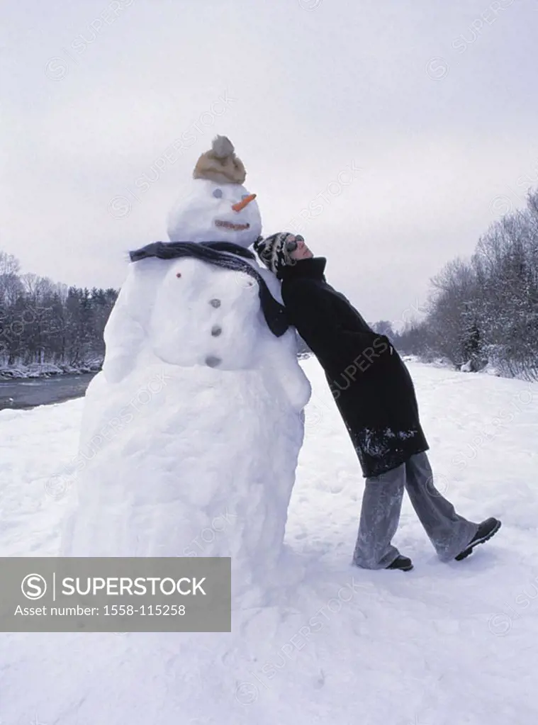 Snowman, woman, leans, at the side, people quite-bodies, winter-clothing, get along coat, cap headgear sun glass leisure time holidays, Christmas time...