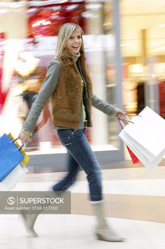 Woman, young, smiles, tote bags, shopping sprees, fuzziness series people 20-30 years blond, long-haired, goes cheerfully, quite-bodies, spiritedly, l...