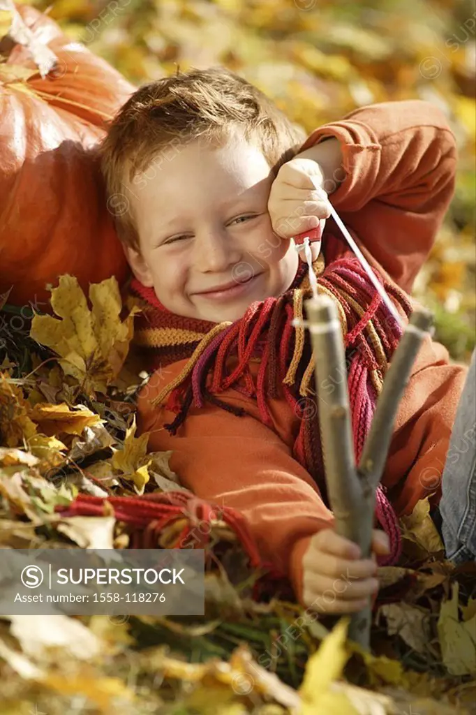 Give birth, catapult, fall foliage, lies, aims, cheerfully, smiles, outside, gaze camera, child, 5-8 years, louse-jack, scoundrel, red-hairy, brats, a...