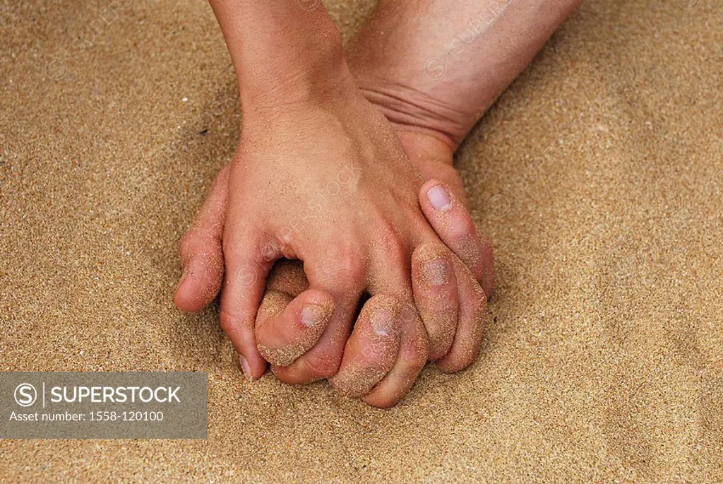 Sand, hands, hand in hand,