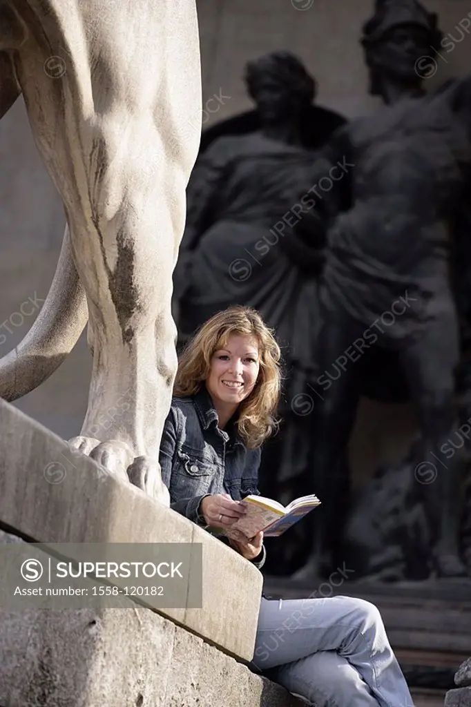 Germany, Bavaria, Munich, commander-hall, lion-statue, detail, woman, young, sits,