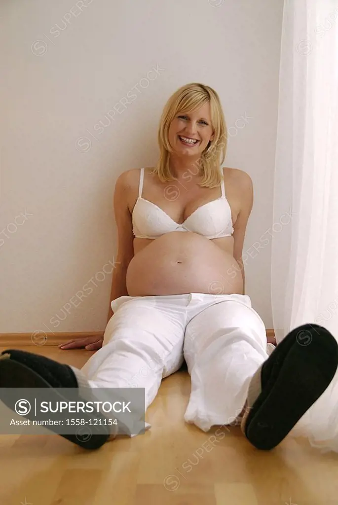 Floor, woman, young, pregnant, sits, laughs, baby-stomach, bare, cheerfully, gaze camera, curtain, people, 30-40 years, blond, BRA, pants, white, stom...