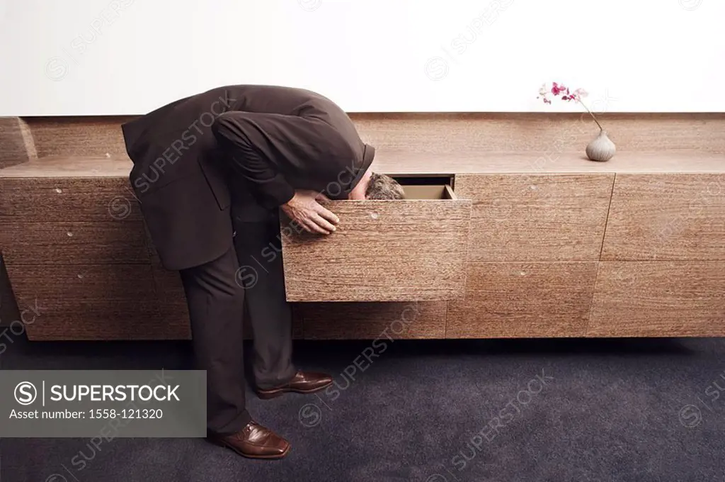 Man, suit, bends down, sideboard, drawer, seeks, at the side, series people 40-50 years, business, business-clothing, indoors, office, living, modern,...