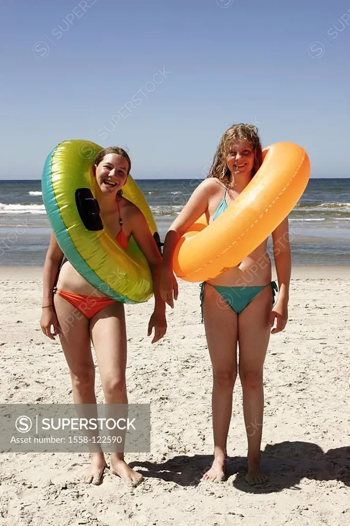 Girls, two, cheerfully, bikini, swimming-tires, beach, stands, people, teenagers, teenagers, friends, gaze camera, fun, joy, laughter, summers, vacati...