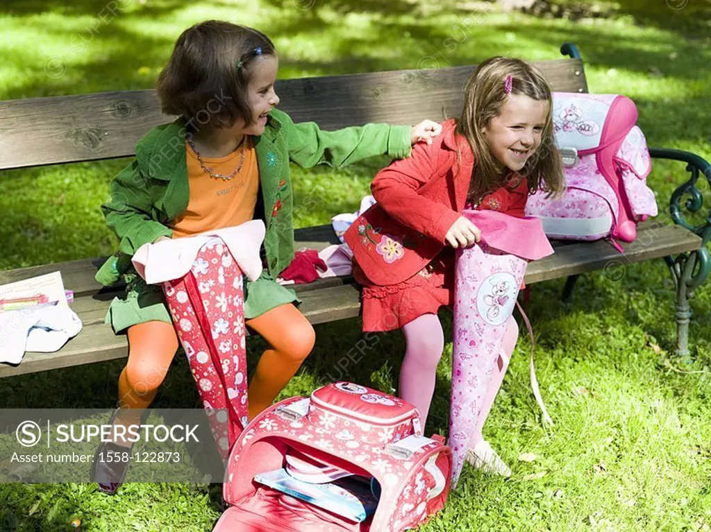 Garden, wood-bank, girls, school-bags, unpacks, cheerfully, series people children, friends, sisters, twins, 6 years, garden-bank, sits, satchels, ABC...