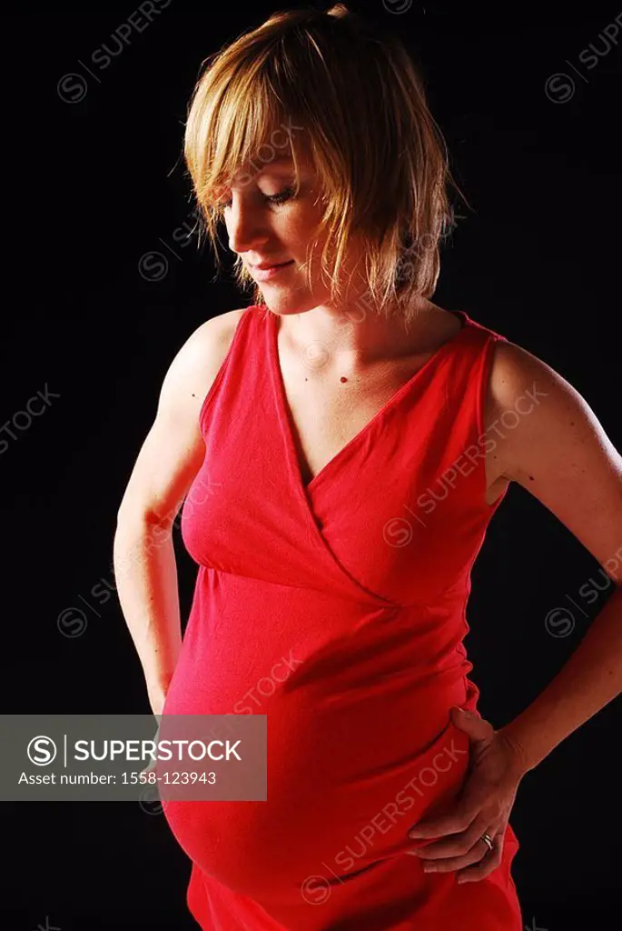 Woman, young, pregnant, dress red, gaze lowered, smiles, detail, series, people, 20-30 years, pregnant, blond, pregnant-sheep-dress, pregnancy, baby-s...