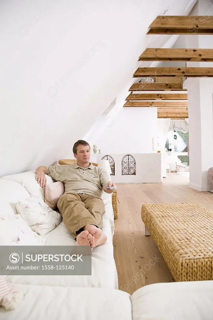 Living rooms, couch, man, lies, relaxes comfortably, long-distance-service, gaze distance, thoughtfully, apartment, brightly, comfortably, people, 40-...