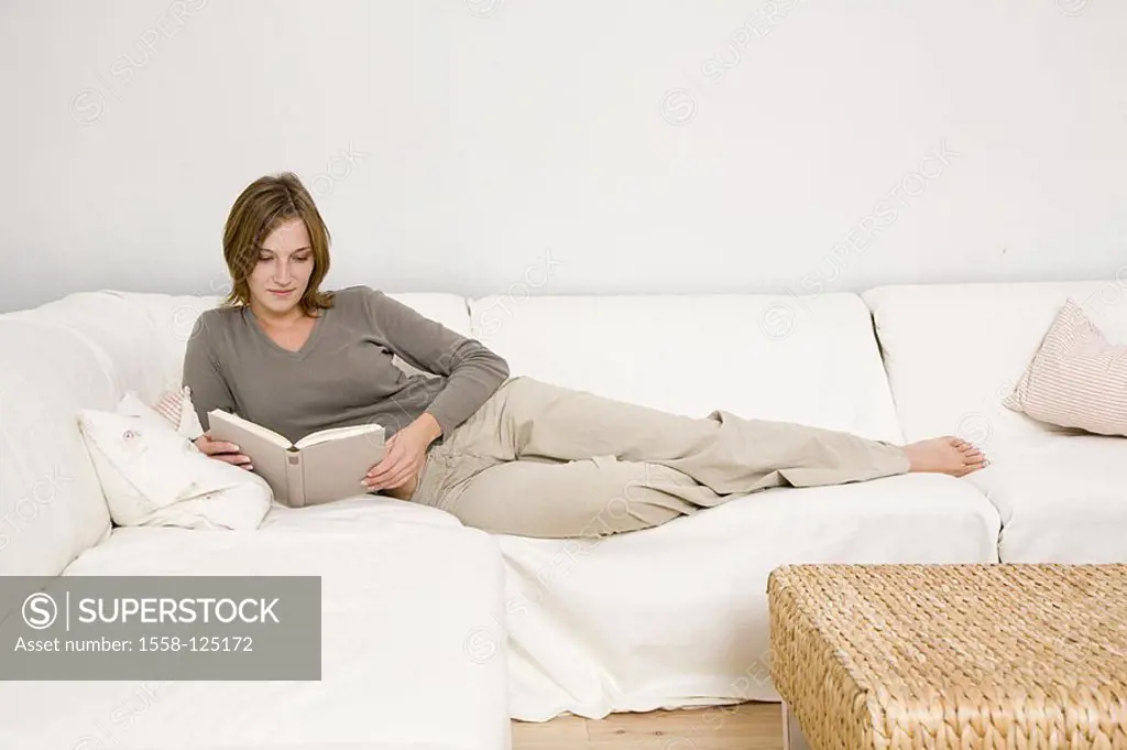 Living rooms, couch, woman, young, lie, reads, book, relaxes, apartment, people, 20-30 years, barefoot, single, however contentedly comfortably, liter...