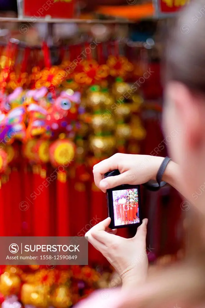 European tourist taking a picture in Chinatown, Singapore