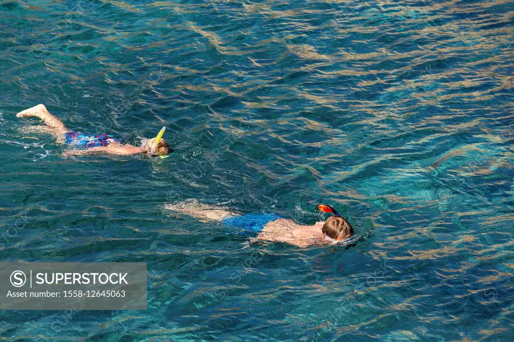 snorkeling in the bay Cala Binidali, Island Menorca, the Balearic Islands, Spain