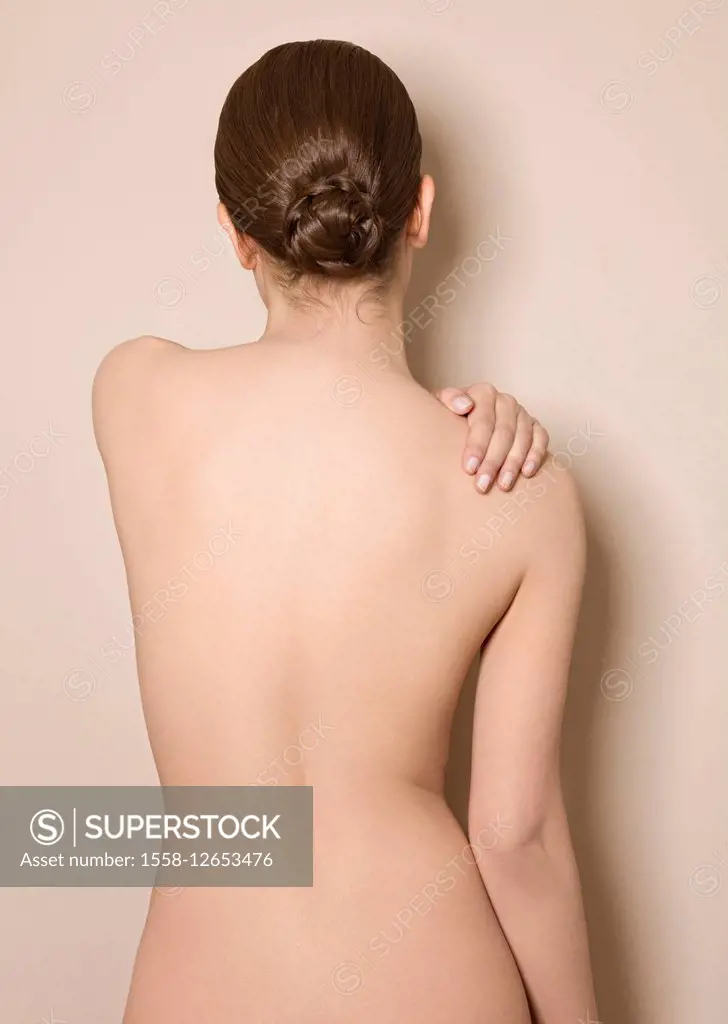 Woman, nude, back view, hand on her shoulder, half portrait,