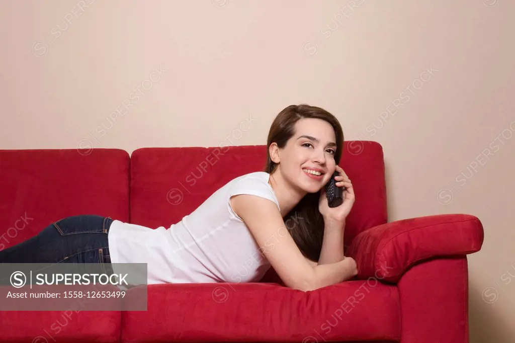 Woman, young, lie, couch, telephone,