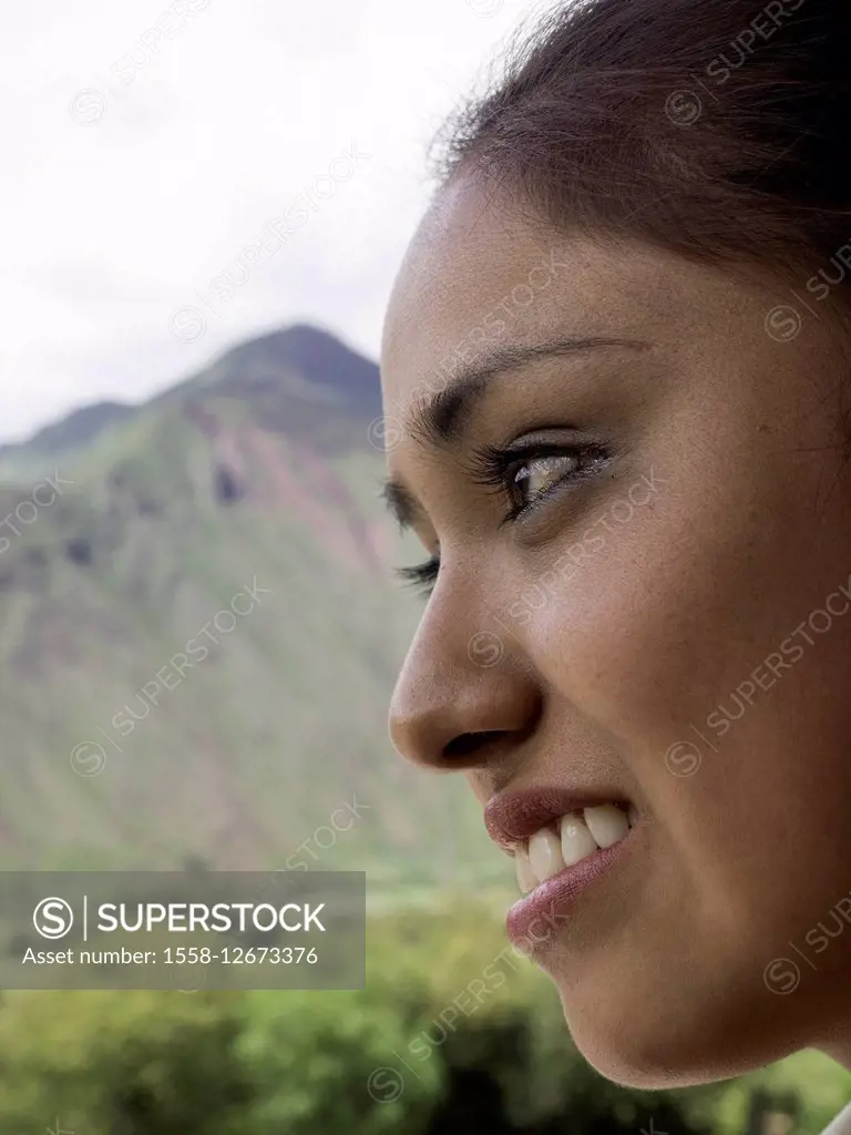 face of smiling young adult Peruvian woman