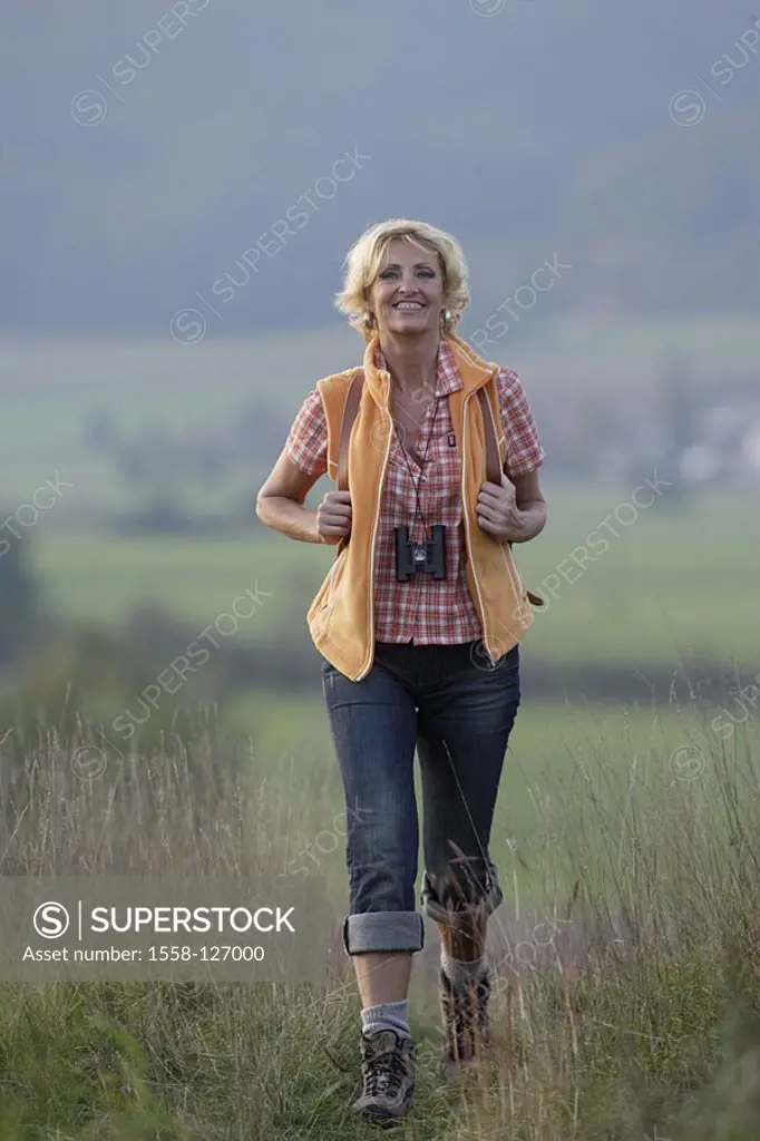 Woman, hiking, autumn, cheerfully, laughs, gaze camera,