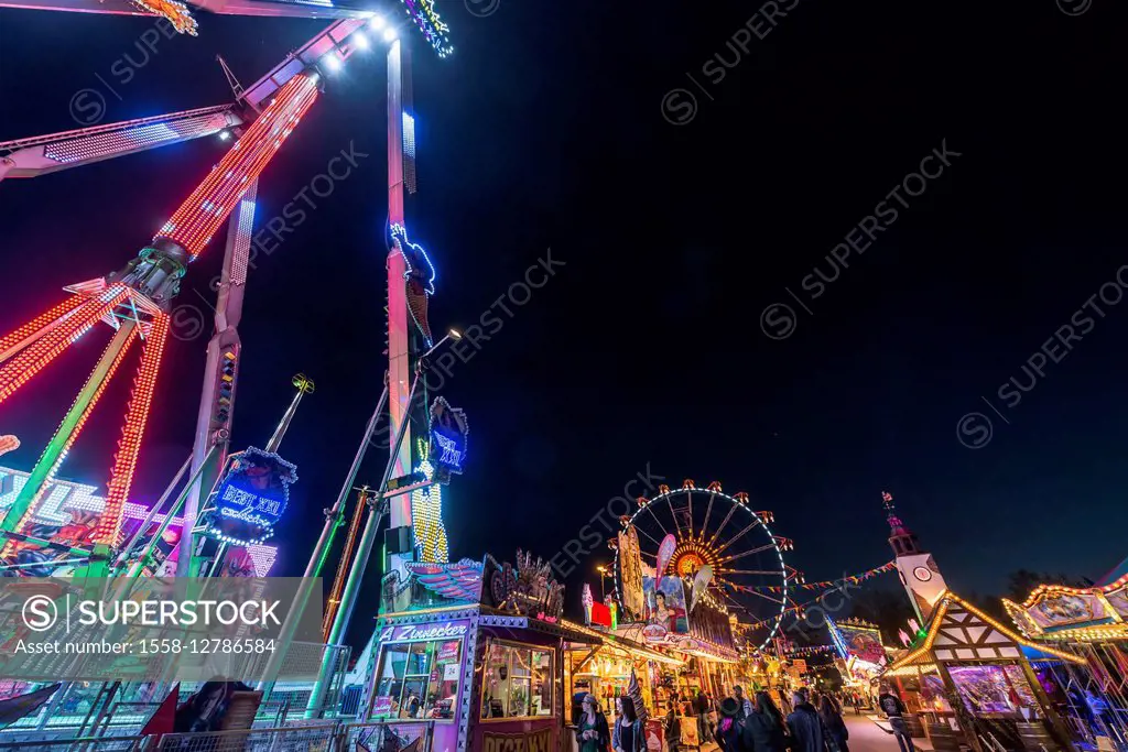 Frankfurt on the Main, Hesse, Germany, fairground rides and visitors at the Frankfurt spring fair Dippemess