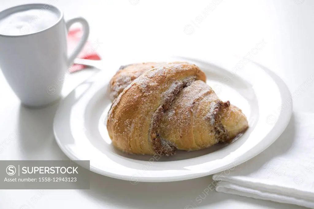 croissants with nuts with cup of cappuccino