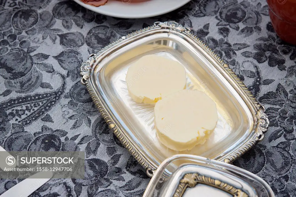 Butter in silver butter dish