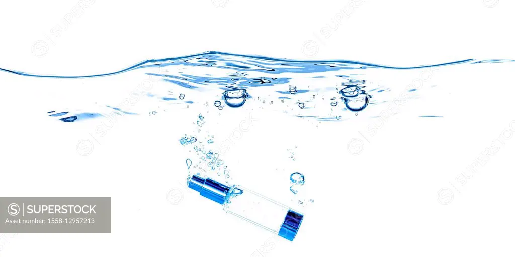 Cosmetics bottle in the water