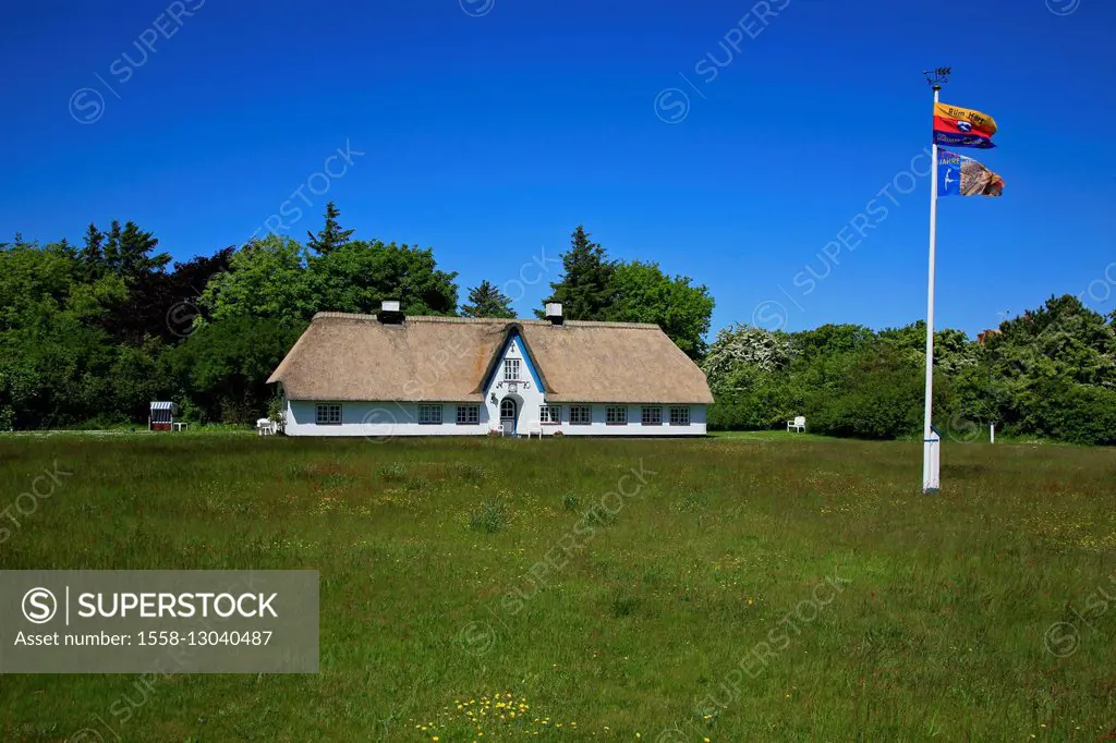 White Frisian house of 1770 on green meadow in the street 'Up de Hiir' in Braderup (municipality) on the island of Sylt,