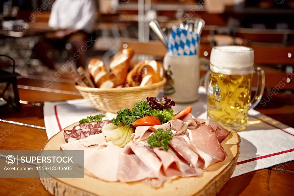 Snack on chopping board with beer