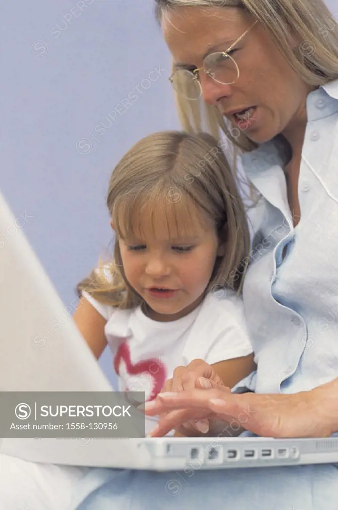 Mother, daughter, laptop