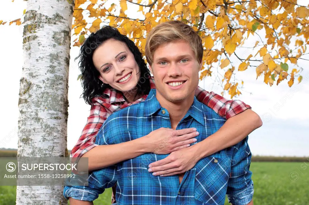 Couple, young, smiling, embracing, half portrait,