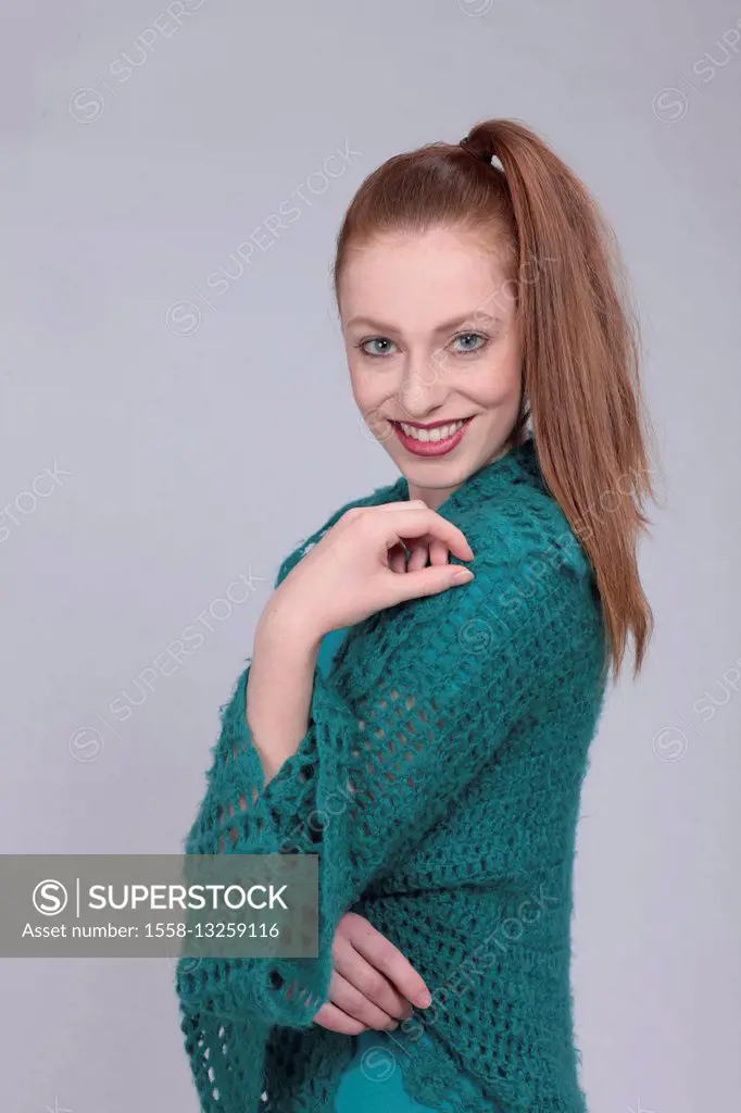 Young woman, red-haired, cardigan, petrol, half portrait, studio,