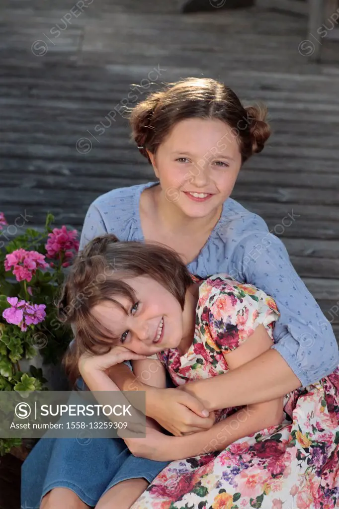 two girls, smiling, embracing, portrait,