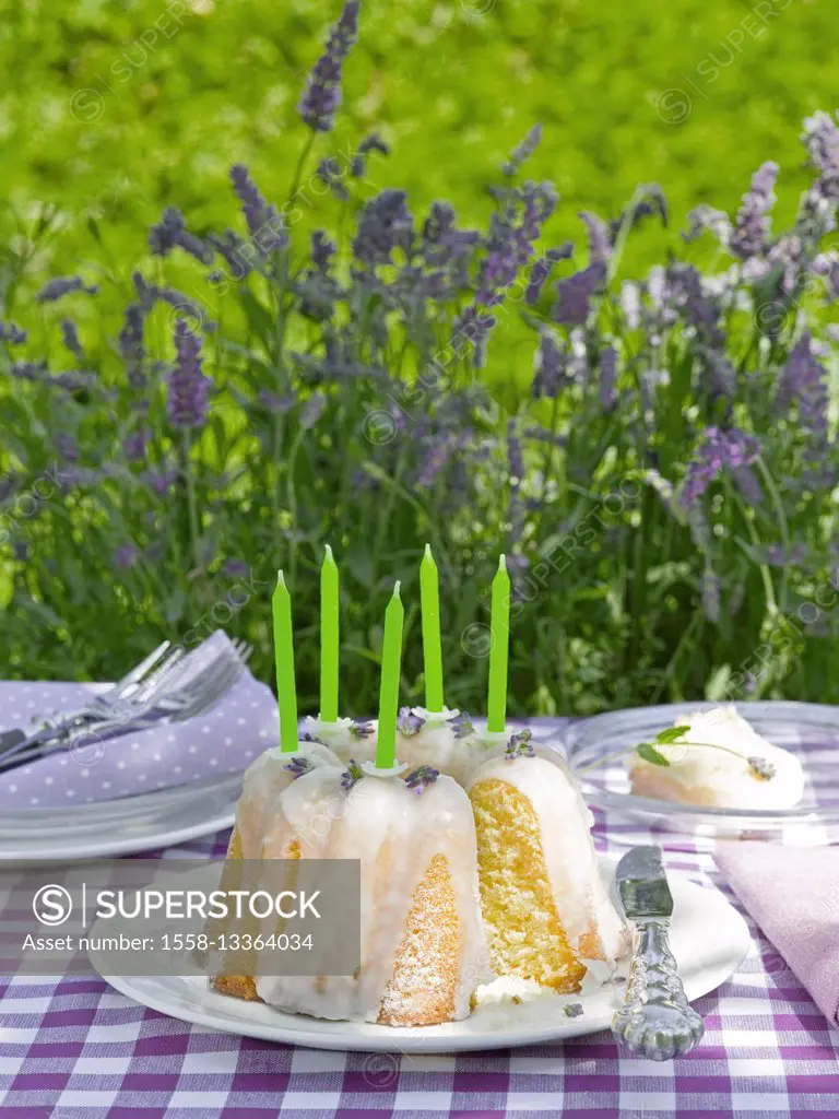 Birthday Gugelhupf (cake) with candles and lavender