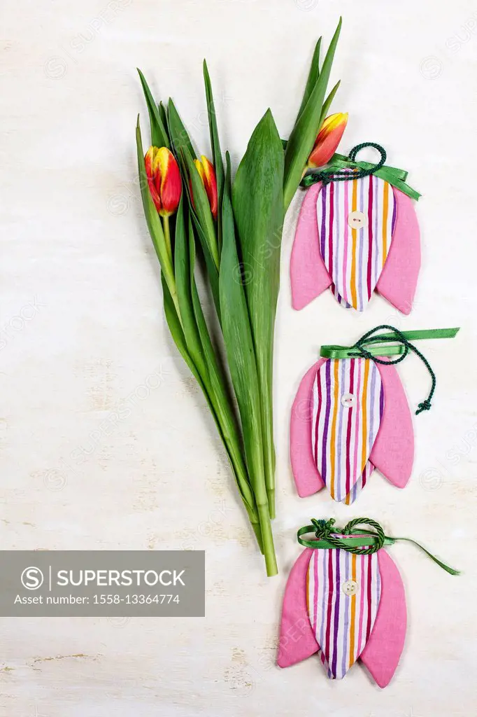 Arrangement from real tulips and tulips made of cloth
