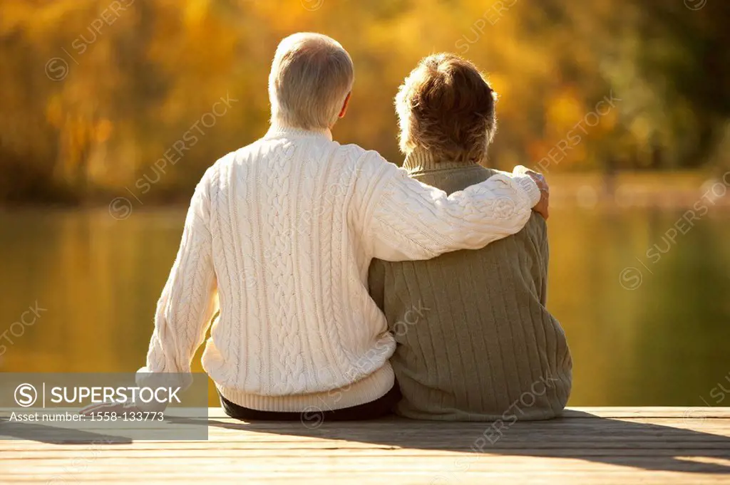 lake, bridge, senior couple, sitting, happily, embrace, back view, autumn, dusk, pension, people, 66 years, 60-70 years, seniors, two, pair, couple, a...