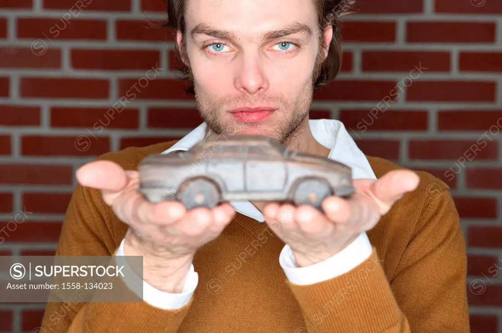Man, young, seriously, with pride, presents, car-model, wooden, portrait, people, 20-30 years, 30-40 years, dark-blond, Dreitagebart, car-collectors, ...