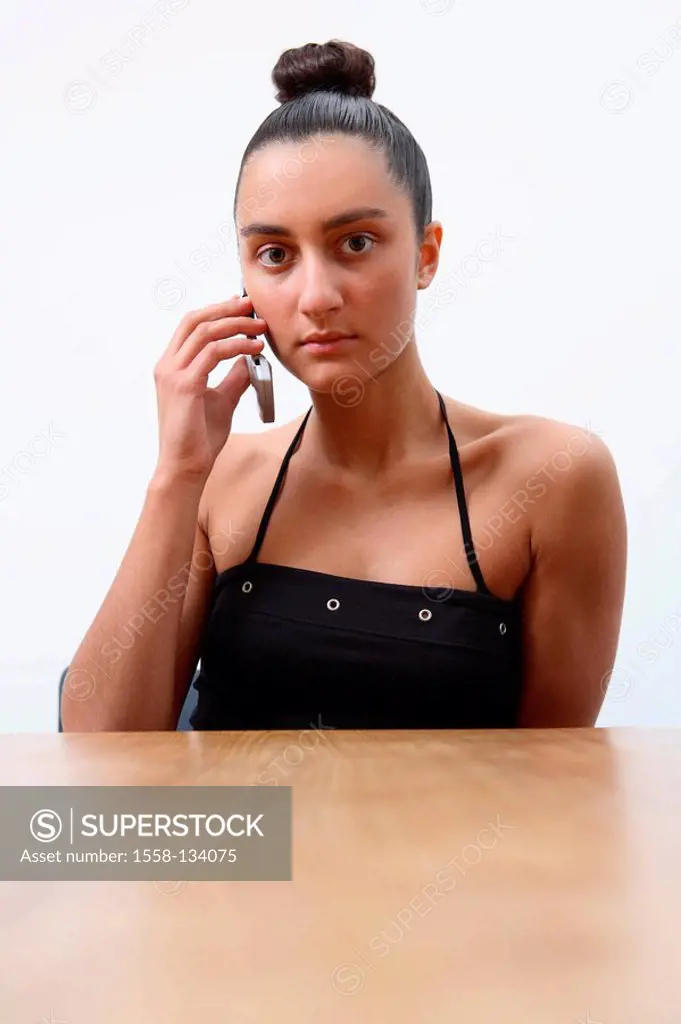 Table, woman, young, cell phone, telephones, seriously, portrait, people, girl, 16-20 years, 20-30 years, dark-haired, hairdo, hair-knots, telephone, ...